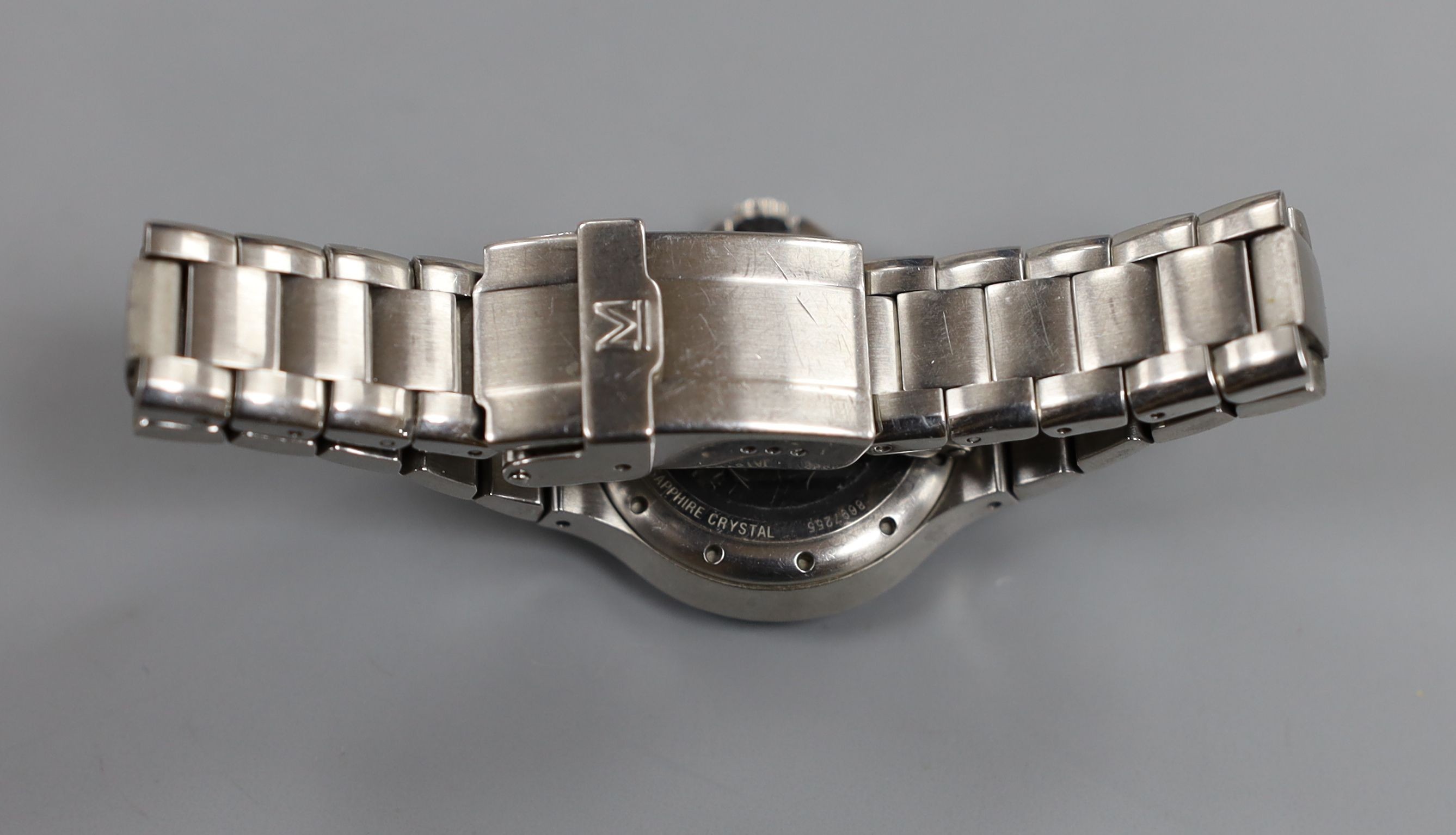 A lady's modern stainless steel Movado quartz wrist watch, on a stainless steel Movado bracelet, with box.